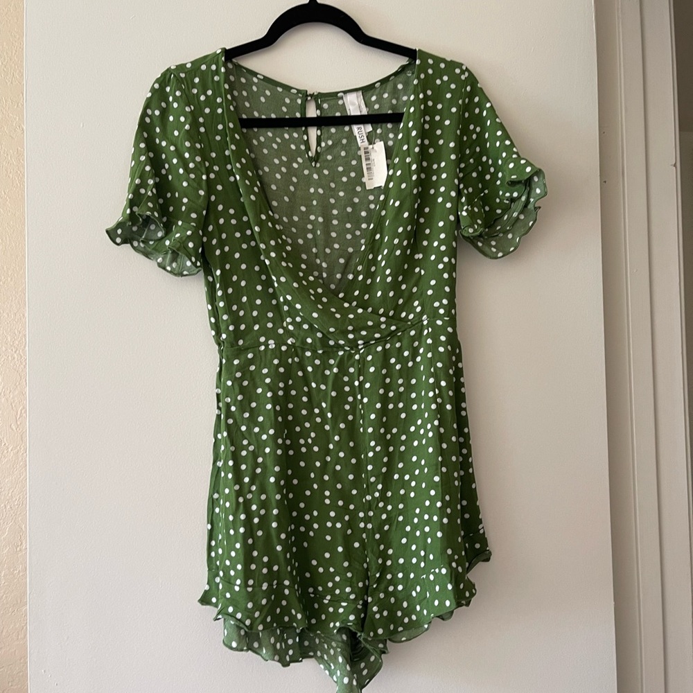 NWT Green romper with white polka dots with frilly edges on sleeve and bottom